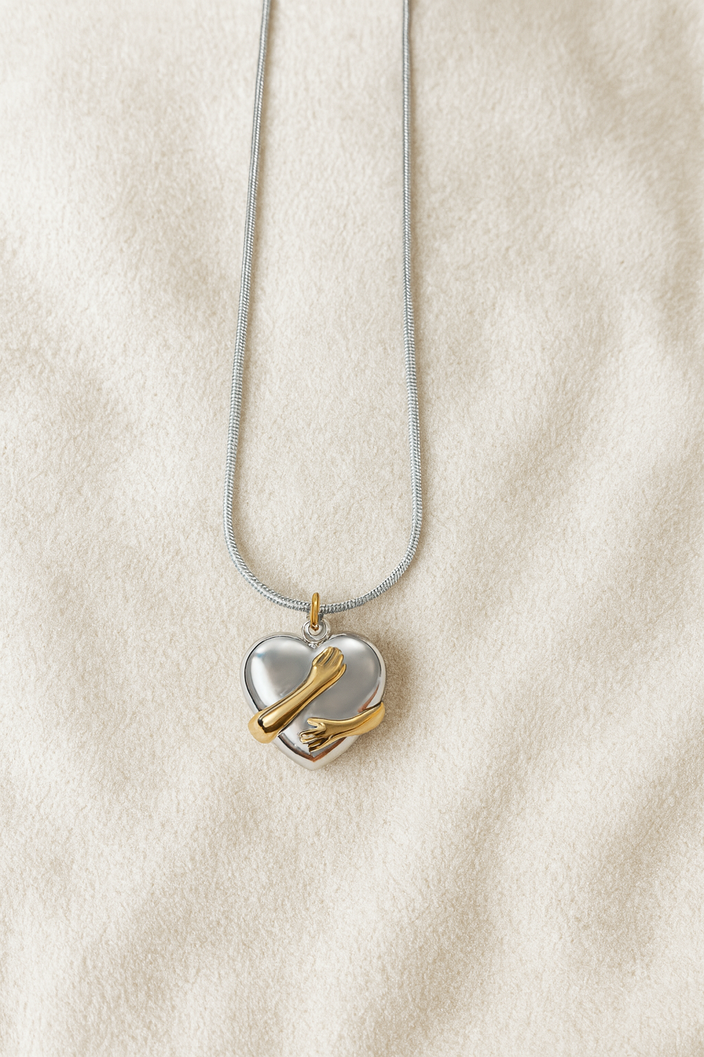 Elegant Dual-Tone Heart Embrace Pendant with Silver Chain